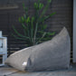 Graphite corduroy Shloomfy lounger on an outdoor deck