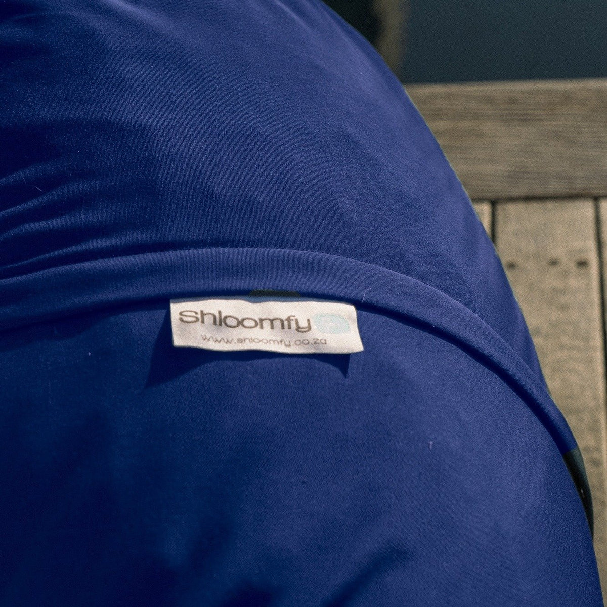 Close-up of the Navy Sunny & Shade outdoor fabric on a Shloomfy beanbag
