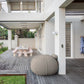 Putty Shloomfy patio beanbag on a wooden deck beside the lawn