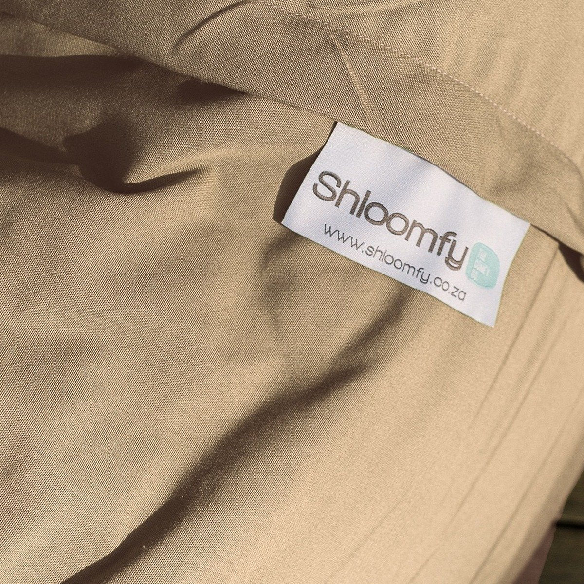 Close-up of the Sand Sunny & Shade outdoor fabric on a Shloomfy beanbag